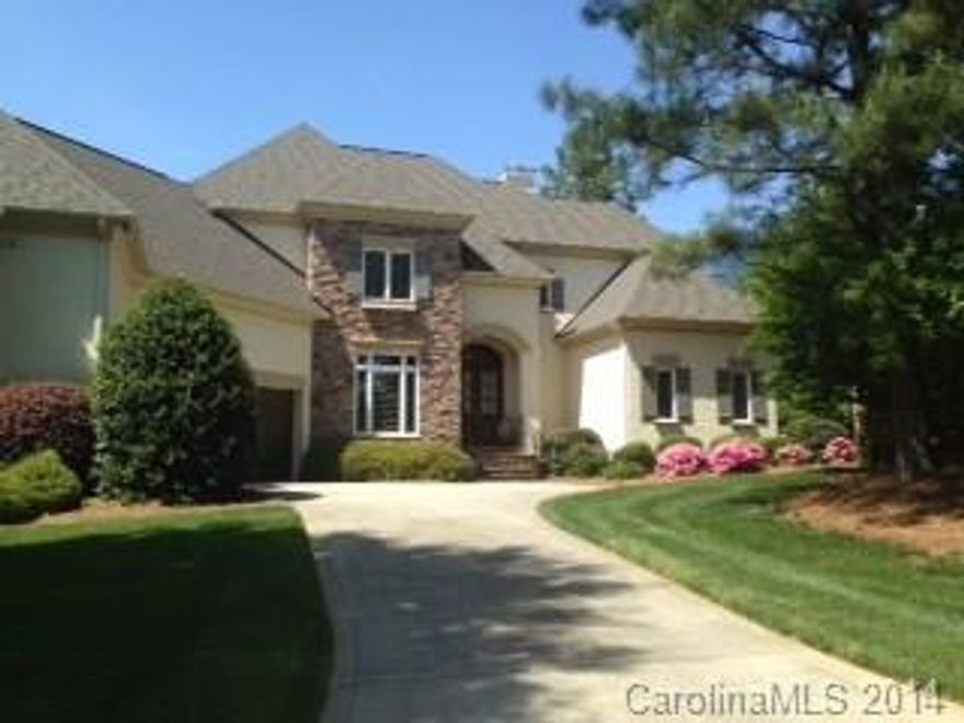 Custom built Ballantyne Country Club home with tons of upgrades. Master suite on main level. Kitchen includes maple glazed cabinets, walk in pantry, ss appliances, center island, breakfast and sitting areas.  Granite in Kitchen, laundry and all baths.  Media room w/coffered ceiling & built-in 64" TV to stay!! Plantation shutters throughout. Hardwoods throughout main downstairs living area.  3 car garage w storage room.
