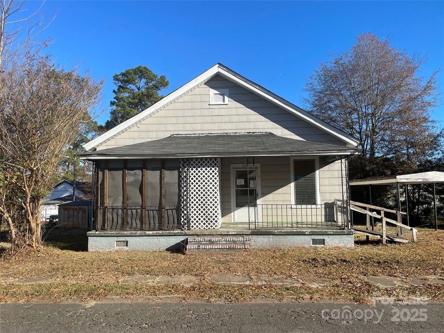 3 Bedroom 1 Bath. Living Room features 10 Ft Ceilings. Washer Dryer Connect. Covered Front Porch. One Car Carport w Utility Bldg. This fixer-upper offers incredible upside for the right buyer/investor. Needs TLC priced accordingly. Property Sold As Is