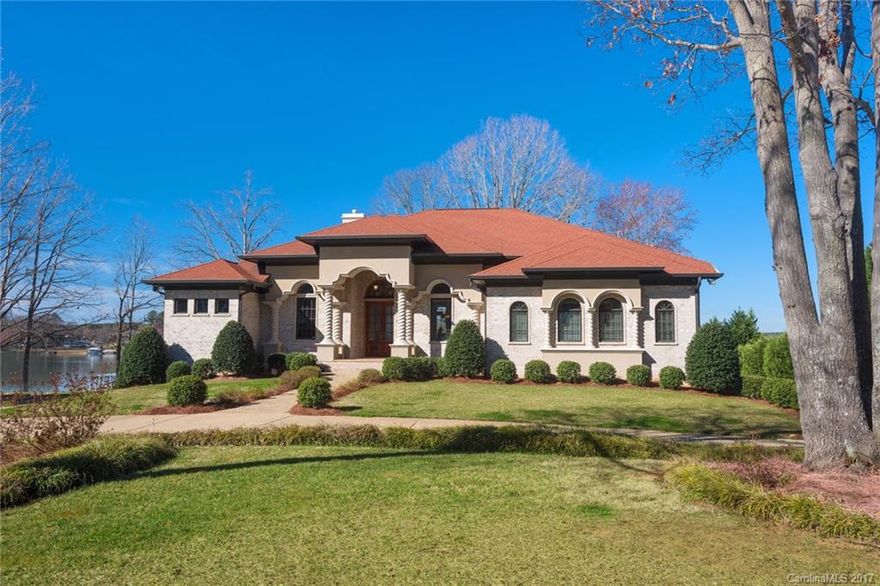 Spectacular waterfront custom home with views of Lake Norman from almost every room! An entertainer's dream, this home is bright, neutral and arrives just in time for summer fun. Main level offers a fantastic open floor plan with gourmet kitchen open to the great room and breakfast area. Lovely master suite with fireplace and terrace access. Lower entertaining level with billiards, media and second kitchen. Enjoy the lake lifestyle thanks to the boat dock and lift, boat ramp and private "beach"!