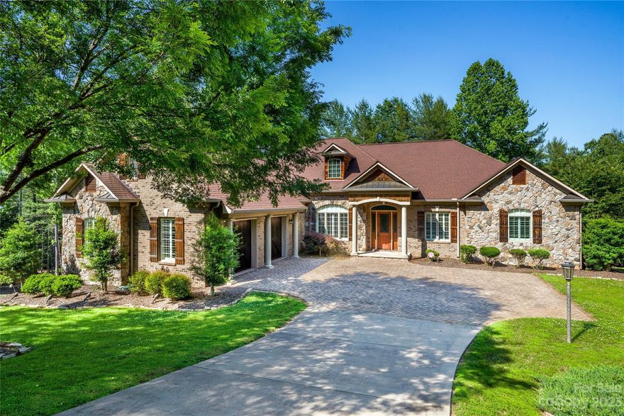 Elegant Lake James waterfront home, refined for full-time luxury or your dream get-away.  Note first the charming landscaping and ease of access to the rustic brick and stone entry and ample garage.  Main level living here includes an immense great room with vaulted ceilings and huge kitchen leading out onto the screened porch and deck overlooking the water, allowing for the whole family and friends to gather together.  The primary suite has it all, including an all-season room to take advantage of the view.  Need sleeping room for the whole team?  The basement is just as large as the main level and includes 2 more bedrooms (5 total), another large family room, and a substantial rec room broad enough to play corn-hole inside!  But, you'll want to be outside too, where you'll find an easy connection to the substantial, well-maintained, covered sitting area and floating dock.  SouthPointe is a distinguished community, close to Morganton, with pool and clubhouse amenities.