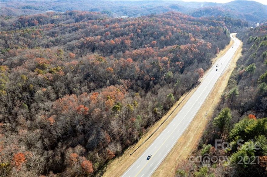 Exceptional opportunity to own approximately 200 acres along NC Highway 64 West.  This large acreage tract is well suited for many uses and features 4,000 feet (approx.) of highway frontage, rolling topography, and mountain views.  The location is convenient to Brevard, Lake Toxaway and Sapphire as well as Gorges State Park, Dupont State Forest and Pisgah National Forest.  Discover this prime investment opportunity in Western North Carolina.  Owner financing is available.