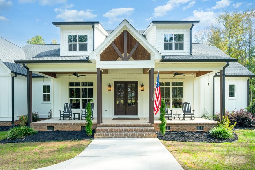 Imagine driving through your private gates at the end of the day, leaving the noise of the world behind as you enter your own 11-acre sanctuary. The long driveway opens to a charming custom farmhouse, where the front porch looks out over pastures and the back deck feels like a mountain retreat.

Step inside and you’re immediately connected to history. The mudroom greets you with true salvaged brick from the Illinois Brick Company—bricks that once survived the Great Chicago Fire of 1871. It’s not just a space to drop your coat and boots; it’s a conversation piece, a reminder that this home was built to be extraordinary.

On the main floor, life flows effortlessly. A cozy primary suite with its own fireplace and spa bath feels like a private retreat, while the two-story walk-in closet—complete with built-ins and a dedicated vanity—turns getting ready into a luxury experience. The gourmet kitchen, with its GE Monogram appliances, oversized island, and butler’s pantry, isn’t just for cooking; it’s where family recipes come alive and memories are made. And with built-in Bluetooth speakers throughout, every moment has its own soundtrack.

Evenings spill naturally outdoors, where low-maintenance decking and a gas fireplace with a TV set the stage for sunset dinners, movie nights under the stars, or simply unwinding after a long day. Want a pool? The backyard is ready—complete with the design pictured and quote in hand.

For those who crave adventure, the land itself is a playground. Wake up early for deer or turkey hunting on your own property, set up a spot for target practice, or clear the flat land to create pastures and a barn—yes, horses, goats, and more are welcome. A full workshop with power and water makes every project possible, while the fully encapsulated crawlspace gives peace of mind that this home was built with care.

This isn’t just land—it’s lifestyle. Build an in-law suite, create a rental for extra income, or even subdivide the property (a rare opportunity, as this is the only lot in the community with subdivision rights).

From your front porch, you’ll watch the sunrise over green pastures. From your back deck, you’ll see the sun set against a wooded, mountain-like backdrop. Here, every view reminds you that you’ve chosen a life of peace, freedom, and possibility—all just minutes from modern conveniences.

And with new schools—Liberty Hill Elementary, Roosevelt Middle, and Lake Wylie High (opening 2026)—this property isn’t just about today, but the future too.


Rare. Remarkable. Ready for you to write the next chapter of your story