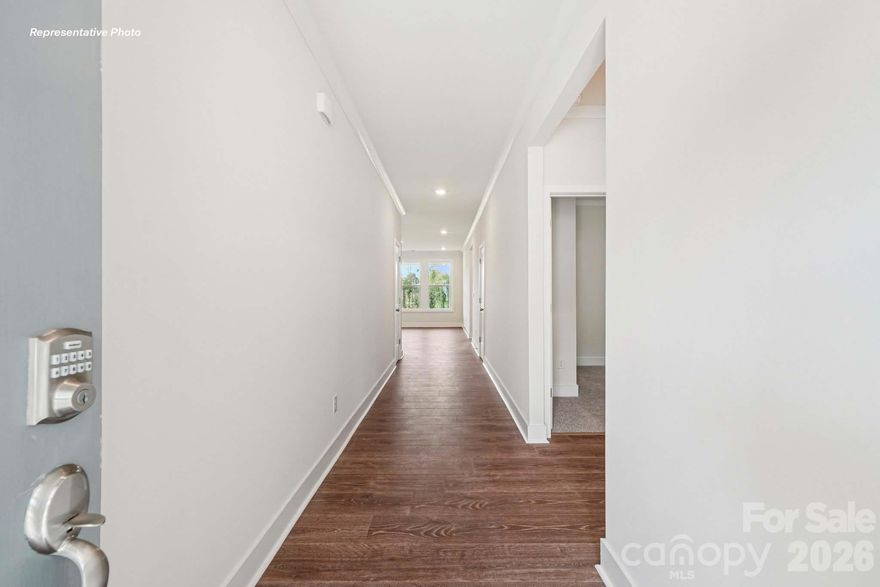 The Cedar is one of the popular plans here at Westport. This home is 1.5 stories with four bedrooms and 3 full baths.

The moment you step inside the home, you're greeted by an inviting foyer that leads you into the center of the home. The family room seamlessly connects with the dining room and kitchen, providing space for entertaining. The chef's kitchen has modern appliances, a pantry closet, and a kitchen island with breakfast bar. The primary suite offers an en-suite bathroom with dual vanities and a large walk-in closet. The additional bedrooms share access to a spacious secondary bathroom. You’ll find a covered patio out back, perfect for outdoor entertaining or enjoying the weather. The Cedar's open layout and single-level living make it the home for you at Westport in York, SC.