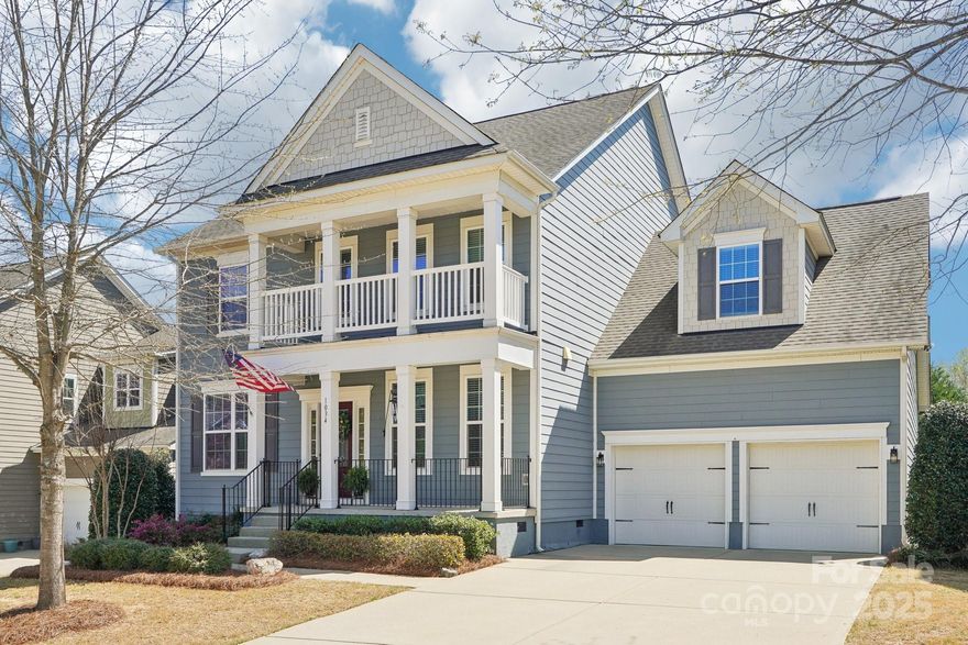 Located in the top rated Clover school district, This stunning home is packed with upgrades. The gourmet kitchen has a double oven, gas cooktop, and spacious island—perfect for entertaining. The open-concept first floor features an office with French doors, a guest suite with an en-suite bath, and seamless flow into the living and dining areas. Step outside to your backyard oasis, where a screened porch overlooks a custom paver patio, built-in outdoor fireplace, and gas grill—ideal for hosting or relaxing. The private wooded backdrop and fruit trees, including apple and peach, create a serene retreat.Upstairs, the primary suite offers a massive sitting area, while the secondary bedrooms provide generous space. The fifth bedroom/bonus room includes its own private bathroom, offering versatility for guests or recreation.Located in a sought-after neighborhood with amenities that include a community pool with lake views, club house, playground and leased boat slips.