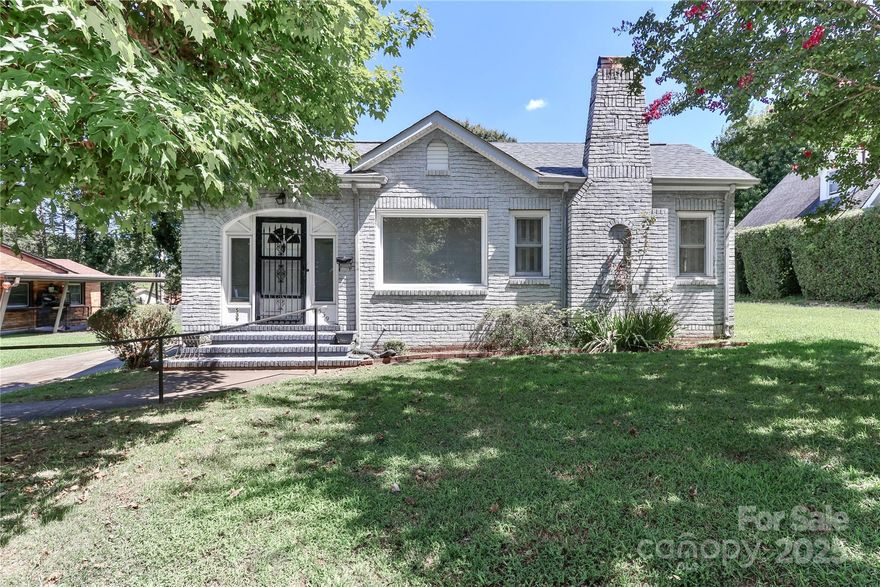 Southern charmer! Unique wavy brick used in the early 1900’s on this preserved white brick cottage. Freshly painted and beautiful refinished hardwood floors. Brimming with character and warmth this home has a cute sunporch, spacious living room with fireplace. Nice dining area. Kitchen and breakfast room. Hardwood floors. Original architectural details. Great location close to Historic  Downtown Statesville. With a little TLC it sure could be a star !!Garage in the back and metal carport. Seller offering up to 5000 in closing cost and home warranty!Electric just updated by K and M Electric and new plumbing ! Attachments with listing!! Motivated sellers! Bring your offer and talent!!