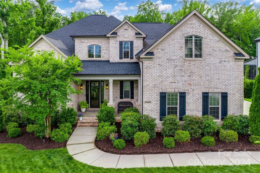 Wait until you see this gorgeous brick home in the prime location that Oldenburg has to offer. Conveniently nestled on a side street, leading up to a cul-de-sac, with a pristine landscaped lawn. This open floorplan has an abundance of natural light, high ceilings, lined with 6 inch floors, and features a primary suite down. The great room anchors the first floor with a beautiful white quartzite stacked fireplace that overlooks the stunning kitchen. Kitchen boasts white cabs, vented range hood, 6 burner gas cooktop, quartz countertops and an eat in breakfast area with custom trim detail on the ceiling. Step outside to enjoy the natural serenity with the covered back porch, that steps down to the flagstone patio w/ built in grilling area, and stone wood burning fireplace. Private primary suite overlooks the back yard with a tranquil bathroom and dual closets. Upstairs offers a great separate area with 3 guest bedrooms, 2 baths, a huge bonus area w/ so many options, & walk in storage.