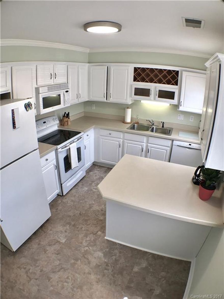 Lovely 3 bedroom townhouse freshly painted throughout (2017).  White cabinet & appliances in kitchen, with kitchen island/breakfast bar & new flooring 06/17.  New carpet (6/17).  Screened in patio in back plus privacy fenced courtyard.   Convenient location just a couple minutes from the light rail station on South Blvd.