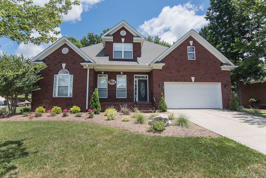 Hard to find beautiful all brick ranch on a corner lot! This immaculate 4 bedroom/ 3 bath home boasts all new hardwoods and carpet throughout the downstairs, new back patio, open floor plan with arched openings, irrigation system, large screened porch and a large master on the main floor with double vaulted ceilings! Upstairs bedroom could also be a second master suite. Do not miss out on this one!