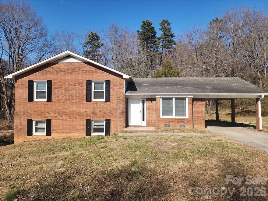 You won't want to miss out on this charming home, located on a Large Lot in Troutman, NC.
This home sits on a generous 0.72-acre city lot offering 3-bedrooms, 2.5-baths. The home offers the perfect blend of privacy and accessibility. Key Features include Split-Level Floor Plan displaying a great flow and separation of living space. The lower level invites you with a wonderful wood burning fireplace and a side entrance. Updated Flooring & recent Paint make this home move-in ready with a clean, modern feel. There is plenty of room for outdoor living, gardening, pets, or future additions. The layout and lot size make hosting gatherings effortless. With the convenient location. This is the perfect home for those wanting easy access to Troutman’s school district, grocery stores and major highways. Enjoy the charm of a small town with quick access to Mooresville, Statesville, and Lake Norman.