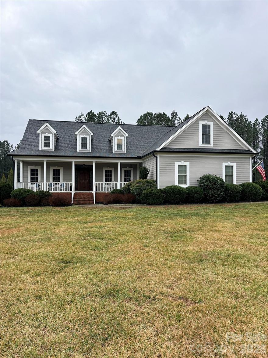 Discover refined luxury on 2.18 pristine acres in one of the area's most coveted neighborhoods. This exquisite custom-built home  masterfully blends serene country elegance with effortless access to Hickory, Charlotte, and Mooresville, offering over 3,500 square feet of sophisticated living space.

Step inside to an inviting split floor plan on the main level, anchored by a sumptuous owner's suite designed as your personal retreat. Relaxing garden tub, his and her sinks, and oversized walk through closet. The dramatic two-story great room captivates with its soaring ceilings and elegant fireplace, creating an ideal centerpiece for gatherings. Complementing this are two additional generous bedrooms, a full bath, and a chef-inspired kitchen featuring abundant custom storage, expansive prep surfaces, a bright breakfast nook, and a separate formal dining room perfect for every occasion.

Ascend to the upper level, where a spacious fourth bedroom with its own private full bath awaits, alongside a versatile bonus room and a dedicated craft or office space ready to inspire your personal pursuits. Outside, unwind on the expansive deck or in the large screened porch, overlooking beautifully open grounds complete with a charming fire pit—ideal for year-round enjoyment. A wide driveway provides ample parking, paired with an attached two-car garage for added convenience.

This exceptional home combines timeless craftsmanship, thoughtful design, and rare potential- truly a standout opportunity in today's market. Don't miss your chance to make it yours!