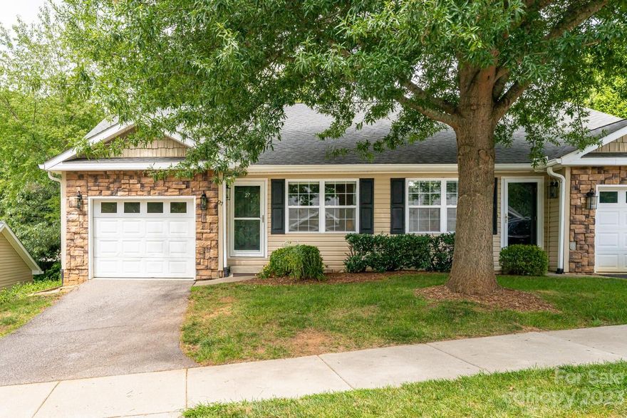 MAJOR PRICE REDUCTION!! Welcome to a well maintained, turn-key home in the highly sought out community of Willow Creek Village. The home features 2 bedrooms and 2 full bathrooms, an open floorplan with laundry room and garage, newer appliances, as well as a new HVAC system. The large kitchen opens up to the dining and living room and hosts plenty of countertop and cabinet space. The primary bedroom ensuite includes a separate entrance to a newly built back deck. Enjoy the worry free convenience of exterior and lawn maintenance by the HOA. Conveniently located just around the corner from the Buncombe County Sports Park, and close to all that West Asheville has to offer.