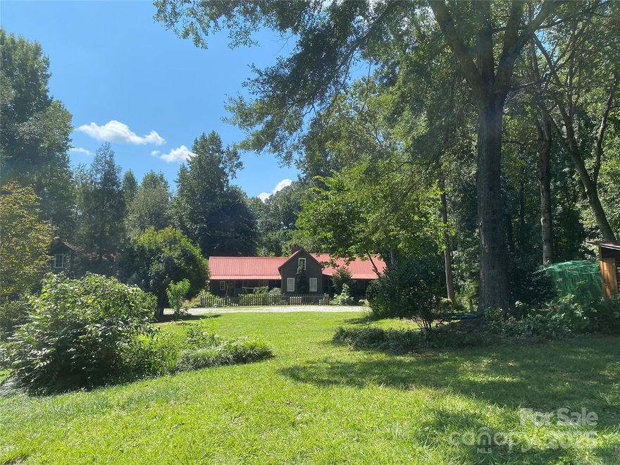 TRULY SPECIAL turn-of-the-century farmhouse with multiple additions that honor the original structure! Charm, history  & modern conveniences, all on 15 private acres suitable for horses, agriculture or family retreat. Located directly on the GENTS Equestrian trail system. Solid wood throughout, no drywall - this construction is the real thing, not decorative shiplap. Acreage includes an established grass pasture near the house, over 5 acres of flat bottom land borders the Middle Tyger River, plus wooded areas that ensure total privacy. Metal roofs, extensive porches and decks, fenced back yard, chicken coop, the answer to all your dreams. Move in ready - most of the living space is new build designed to reflect the original farm house structure. Plenty of space behind the 3 car garage for a livestock run-in or build stalls under the overhang, add the horse fencing and you are ready to go! Perfect homestead property for growing your own food - currently in agricultural status.