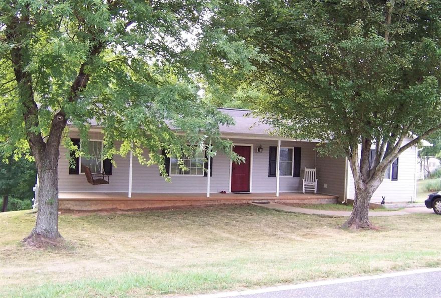 Don't miss this charming  3BR/2BA home that boasts one level living! It includes a gas range, chair molding, an office, spacious under-deck storage, a walk-in crawl space, and a 12x16 wired outdoor building.   Enjoy the mature landscaping and shade from  the covered front porch or enjoy the sun from the large open back deck, which was replaced 4 years ago and is perfect for grilling! This home has great bones and is ready for your personal touch. This one won't last long so don't hesitate to schedule your showing! The professional photos have been scheduled and will be added shortly.