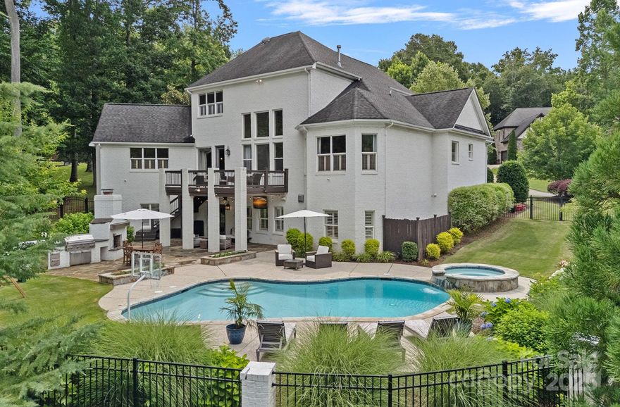 Experience unparalleled luxury in this exceptional 5-bed, 4.5-bath estate in the prestigious Anniston subdivision. The main level showcases a dramatic two-story great room with a stunning fireplace, flowing seamlessly into an expansive open-concept living, dining, and chef’s kitchen—designed for upscale entertaining. The gourmet kitchen features a generous eat-in island, custom cabinetry, and premium stainless appliances. The main-level also offers a home office for refined work-from-home living. The lavish primary suite boasts a spa-inspired bath with soaking tub, large shower, dual vanities, and custom walk-in closet. The walk-out basement impresses with a second suite, full kitchen, gym, craft room & in-home theater. Upstairs offers three bedrooms & a versatile flex space. Outdoors, indulge in resort-style living with a private pool, hot tub and outdoor kitchen. Over $68K in recent upgrades. A flawless blend of comfort, elegance, and the ultimate in luxurious living.