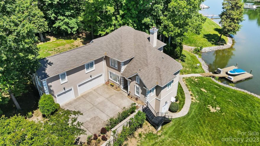 This is the one you've been waiting for! Sitting on a little over an acre, this private lakefront estate has everything you need to call 142 Normandy "home". With just a short walk to Lake Norman Airpark you can enjoy all the activities on the lake and the airport.  The primary suite is on the main; a large kitchen with island and breakfast bar joins the two story living room and large outside deck. There is no shortage of lake views from nearly every room in the house! The Upstairs boasts large bedrooms and a massive bonus room that spans over the oversized 3-car garage. As you make your way to the lake level you enter into an entertainer's DREAM! There's a wet bar, pool table and media room with leather seating plus a full bathroom, bedroom and office. Laundry is on the main and lower levels. Outside is a large patio that has beautiful views of Lake Norman along with a lakeside fire pit. There is a dock and even room for a pool!  Amenities include a pool, clubhouse and boat launch.