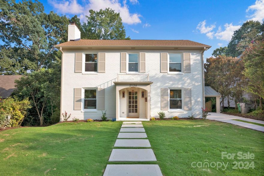 Welcome home to 2136 Malvern Rd, an exquisite Casa Stiles remodel situated on a picturesque, tree-lined street in prestigious Myers Park. This classically stunning home has been meticulously updated from top to bottom, featuring brand-new electrical systems, a new roof, new Champion windows, and fully renovated bathrooms, kitchen, and flooring. Throughout the home, you'll find designer tiling, elegant lighting, and premium fixtures. The upper level offers 3 spacious bedrooms, while the beautifully finished basement provides a 4th bedroom, perfect as a 2nd living quarters. Enjoy the convenience of 2 laundry rooms and the efficiency of a tankless water heater. The basement also includes a stylish bar and kitchenette, ideal for entertaining. Retreat to the luxurious primary suite, designed with comfort and sophistication in mind. Every detail in this home has been carefully considered to provide a seamless blend of classic charm and modern amenities.