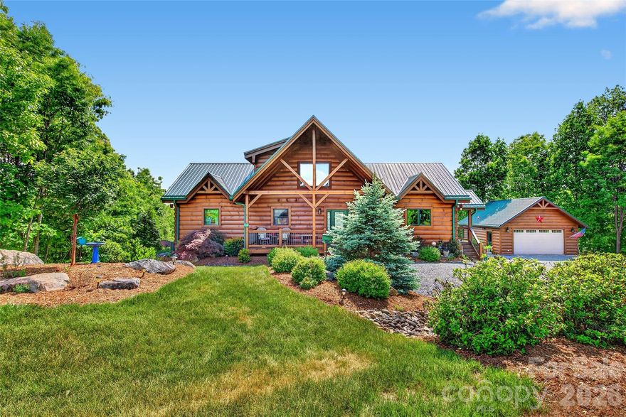 Welcome to the Land of Hopes and Dreams... this exceptional custom-built log home in the highly sought-after gated community of Grandview Peaks—where thoughtful design, quality craftsmanship, and mountain living come together beautifully.

Inspired by the owner's vision, this authentic log cabin was carefully designed and built by the highly respected Powell Group, known for constructing many of the community’s finest homes. Crafted with true 12-inch D-shaped logs, this home offers timeless character paired with modern comfort and efficiency.

A welcoming front foyer sets the tone as you enter the home, complete with a convenient powder room for guests. From the moment you step inside, your eyes are immediately drawn through the open living space to a wall of large windows showcasing exquisite mountain views—creating a stunning first impression.

Designed for easy main-level living, the home features an open-concept floor plan filled with natural light, a spacious primary suite, and a conveniently located laundry area within the oversized primary closet. The well-appointed kitchen offers an excellent layout with a large pantry, ideal for both everyday living and entertaining.
Upstairs, a loft provides additional living or sleeping space, while the lower level offers abundant storage and flexibility, with a large den, two bedrooms and a full bath.  The home is perfectly designed to comfortably host family and guests.
The Outdoor living is equally impressive, with expansive covered front and rear porches—perfect for relaxing, entertaining, and taking in the peaceful surroundings. The property is professionally landscaped to attract birds and hummingbirds and features a cozy wood-burning fire pit for enjoying cool mountain evenings.
Additional highlights include:
• Metal roof on both home and garage with a long lifespan
• Strategically positioned garage to maximize views of Mount Mitchell and the Blue Ridge Mountains
• 250-gallon propane system servicing the fireplace, tankless water heater, cooktop, dryer, and grill
• Beautiful walk-in stone shower with natural lighting
• Ample storage on every level, including the basement
Built with energy-efficient and environmentally conscious (green) features, this home offers both sustainability and long-term value.
Privately situated near the end of a quiet cul-de-sac, this property offers the perfect balance of peace and community. 
Grandview Peaks features a scenic lake, pavilion, recreation area, and walking trails—along with optional social activities for those who wish to participate.

Whether you're seeking a full-time residence or a mountain retreat, this home offers four-season living in one of Western North Carolina’s most beautiful settings.