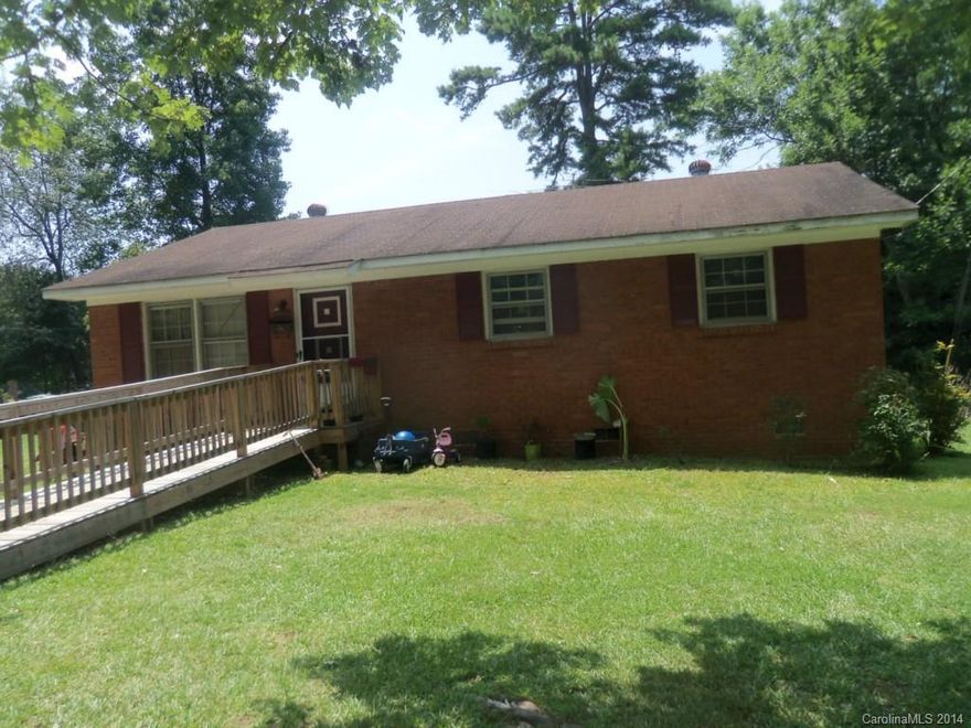 Brick ranch has 4 bedrooms, hardwood floors, spacious eat in kitchen, equipped with handicap ramp, nice flat yard.