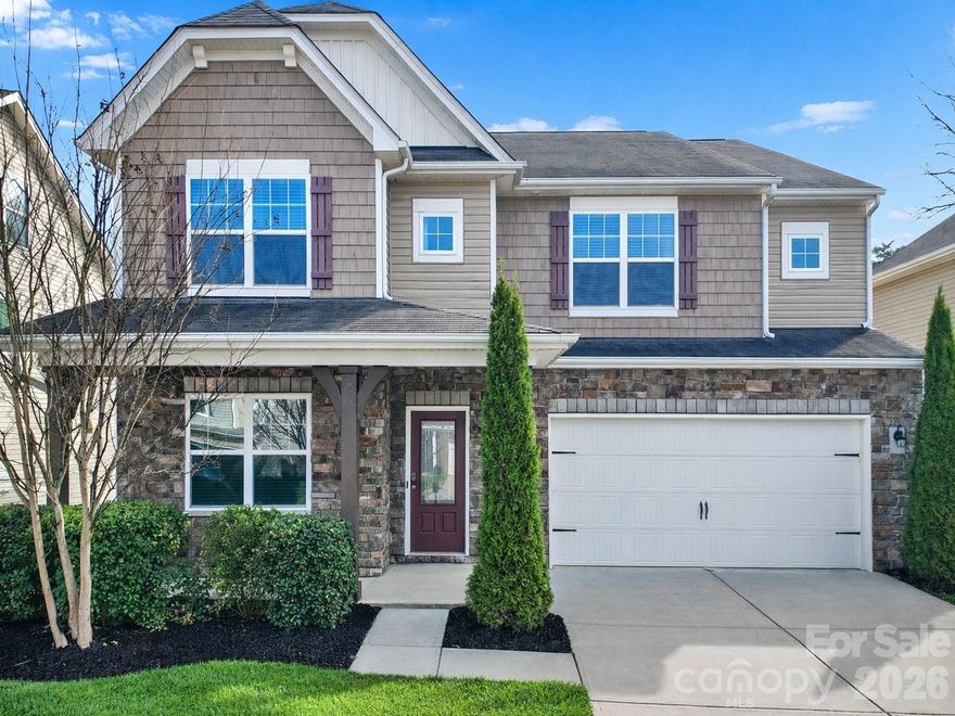 Beautiful, move-in ready 5-bed, 4.5-bath home in the desirable Berewick community in Steele Creek. Covered front porch invites you inside this open floor plan featuring 9-foot ceilings, neutral paint, stylish archways, whole-home blinds, and hardwoods throughout the main living areas. Kitchen offers pendant lighting, tile backsplash, granite countertops, stainless appliances, and a 5-burner gas range with double ovens. Adjoining breakfast area, family room with a cozy gas fireplace, and dining room create the perfect spaces for everyday living and entertaining. A dedicated office provides an ideal work-from-home setup, while the main-level bedroom with attached bath is ideal for guests or multi-generational living. Upstairs, you'll find the spacious primary with an ensuite that includes a vanity with two sinks, soaking tub, shower, and walk-in closet. Three additional bedrooms, each connected to a full bathroom, along with a versatile bonus/loft area and laundry room with linen closet complete the second level. Enjoy the tree-lined backyard while relaxing on the paver patio with sitting wall. Home was recently professionally cleaned and the exterior and driveway power washed. Residents of Berewick enjoy exceptional amenities including a clubhouse, junior Olympic pool, basketball and volleyball courts, playgrounds, and miles of walking trails. Conveniently located near I-485, I-85, and I-77. Easy access to Uptown Charlotte, Charlotte Douglas International Airport, the U.S. National Whitewater Center, and Charlotte Premium Outlets.