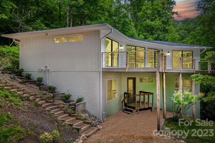 Modern Mountain Vibes. 
Elegant and organically inspired, this home is an exceptional opportunity to own in this sought after gated community with amenities galore. With winter views of the lake, babbling brook below & trails outside your doorstep, this is your tranquil retreat! The great room is flooded with natural light and leads to a sweeping deck for entertaining under the canopy of the forest. Newly renovated inside and out, this stunning home is move in ready with high end finishes throughout! Every bedroom has floor to ceiling windows, an ensuite bathroom, and a walk in closet. The lower level opens to a family room & two guest suites. New features include the entire interior, landscaping, driveways, decks, cable railing, electrical, plumbing and dual zoned AC/heat system. Conveniences abound between close proximity to the gate & amenities. Connestee Falls offers a clubhouse, restaurant, fitness, golf, lakes, pickle ball, tennis, hiking & more!