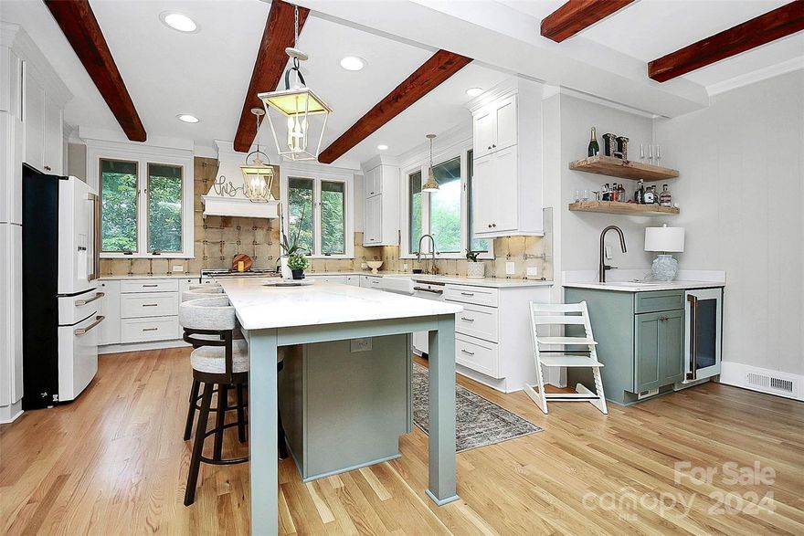 Complete reno of this 70's ranch w/basement in desirable River Hills!  Entry foyer w/custom built in's set the stage for this beautiful home. Private office, kitchen & great room overlooking 15th fairway. French doors in great room open to slate porch perfect for al fresco dining. Kitchen has abundant storage, quartz, white matte Cafe appliance package w/Hallman range, hood, and beams. The 3rd fireplace in dining area off kitchen provides gorgeous brick accent wall. Great room has tray ceilings, LED lighted crown molding, statement chandelier & gorgeous tall windows allowing natural light. Huge primary bedroom w/walk in custom closet. Primary bath has full tiled shower & soaking tub, dual vanity. Guest bath has dual vanity & floor to ceiling tiled tub/shower.  Entertainers dream downstairs with second kitchen, custom walnut bar, pool table, built in dart board, & wine cellar. Need a guest suite or in law quarters?  Full bath & bedroom in lower level also!