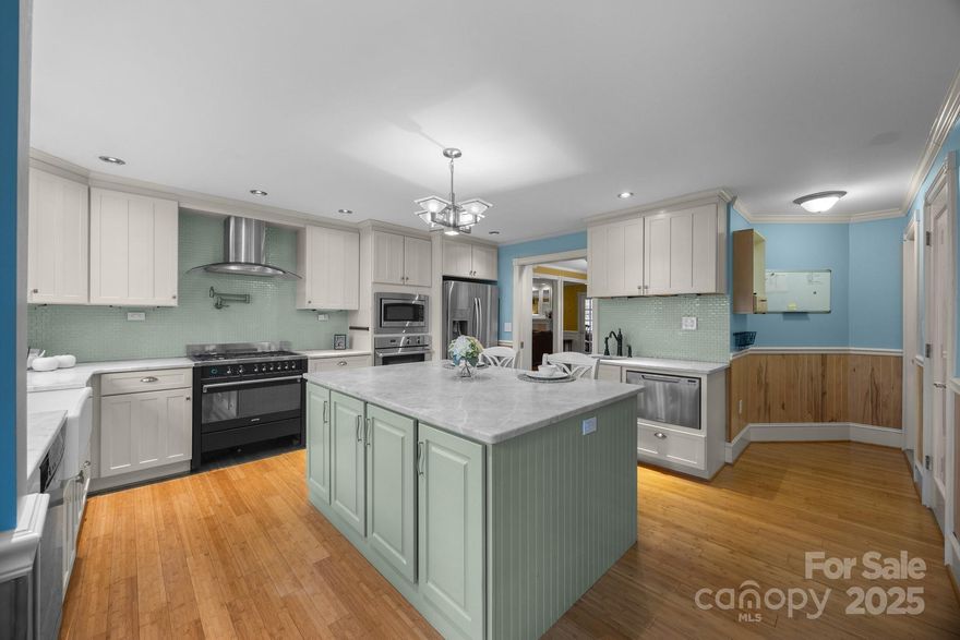 Welcome home to this charming home in the heart of Troutman offering over 3,200 sq. ft. of living space. The updated kitchen features a farmhouse sink & a gas Smeg oven, perfect for any home chef. Enjoy a wine rack in the walk-in pantry, updated cabinetry, backsplash & gorgeous countertops & a stylish island! The living room with a cozy fireplace and the dining room with separate pantry, built-in cabinets and a buffet are perfect for entertaining. The main floor includes an office with built-in desk as well as French doors, updated fixtures & beautiful wood floors throughout. Upstairs, find a spacious master suite with large bath, a bonus/bedroom with full bath, fireplace insert and bar area. Additionally, 2 well appointed bedrooms & full bath, offer plenty of room for guests. The 2-car garage, separate workshop, generous backyard (check out the goldfish) & wired storage building complete the property. This classic home offers endless possibilities to make it your own. Don't miss out!