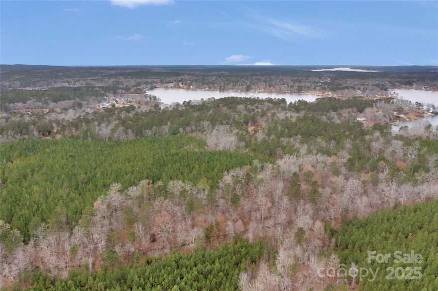 Remarkable +/- 90 Acres in the highly desired Lake Wateree area! With a Ridgeway address, in-between Charlotte and Columbia is a great location. Minutes away from Colonel Creek Landing (Lake Wateree access), gas stations, Lake Wateree Park, and other modern amenities! Easy access to HWY -21, I-77. Large private lot for your custom dream home, family compound, and hunting / sporting tract. Planted timber production throughout with gorgeous hardwood and creek bottoms. ~ 2800 ft of road frontage, tons of space for egress around the property. With the large lot size, pursue building your dream home, use this land for your small farm and other gardening activities. There are multiple age classes of timber. The future owner can leave this in Timber Use for deferred property taxes with the county. Main section is to be subdivided with a RD-1 zoning. The smaller lots are individual parcels with a R-1 zoning. 

There are electrical utilities available at the street.