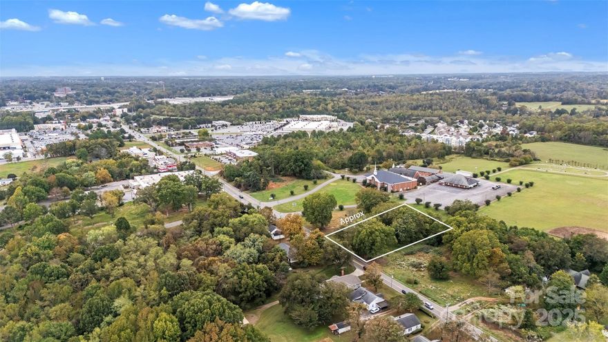 Great lot for future commercial use!!   The lot is a little more then half an acre. There was a house on the lot and there is a septic tank on the property.  The road is to be widen and part of the property has been surveyed losing the road frontage until the new road will be completed.