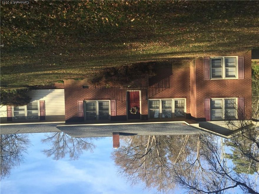 Below tax value! Your search is over. Absolutely adorable brick ranch is a true gem. Bask in all the natural sunlight, relax after a long day in one of the 2 large living ares. Enjoy endless possibilities with all the features this home offers. Enjoy the Carolina mornings & nights by crossing the street to enjoy the quaint park or enjoy cookouts & bonfires in the large back yard. Don't let this one slip by. Own your piece of the American dream -- cheaper than you can rent. $3,000 update allow.