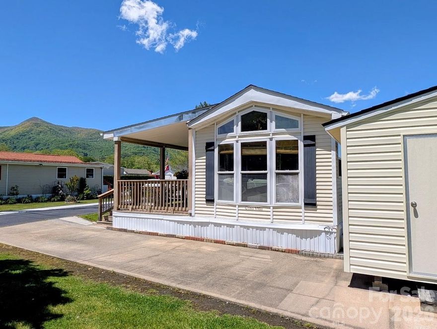 Welcome to easy mountain living at 29 Polka Lane, located in a well-maintained 55+ community just minutes from downtown Waynesville, Lake Junaluska and Maggie Valley. This home offers 360-degree mountain views, enjoyed from a peaceful valley setting with level, paved roads that make everyday access simple and stress-free. With one primary bedroom, and another room that can be used as a bedroom, office, home-gym or other flex-space, this property offers considerably more square footage than typical park models. 

Inside, the home features three mini-split systems for efficient, customizable comfort year-round, along with a gas range that will appeal to anyone who enjoys cooking. The large, updated bathroom provides modern convenience and generous space, adding to the home’s comfortable and functional layout.

Outside, an additional storage shed/workshop offers plenty of room for hobbies, tools, or extra storage. And you will love relaxing on the spacious front porch, enjoying the scenery while entertaining with friends and family. 

This property is ideal for those seeking low-maintenance living, scenic beauty, and a welcoming community atmosphere, all while staying close to Maggie Valley and Waynesville’s shops, dining, and local amenities. This property is being offered fully furnished...the seller will be removing some small personal items. 29 Polka Lane delivers the combination of comfort, accessibility, and mountain charm that makes Western North Carolina so desirable.