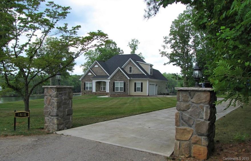 Lake Wylie living at its best! Prime waterfront lot. 1.13 acre. Spacious, open custom ranch with Bonus up. Fabulous views. Great room with coffer ceiling. Stainless kitchen with large island, desk, and easy close drawers.  Huge Dining area. Large Master with luxury bath and dual custom closets. Roomy sec bdrms.  Plantation shutters. Walk in attic storage.  Screen porch. 2 elevated decks.  2 docks (1 covered).  325 feet of rip rap shore line.  Mostly flat yard with back gentle slope to lake.