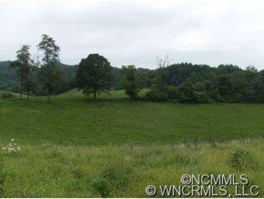 Beautiful farm with those fantastic long range views the area is famous for. This 39 ac farm has over 20 acres of rolling grass land with the balance in large trees. The land has a spring and bold stream. Several barns and outbuildings mean you can begin your ranch on day 1. A small Log cabin by the creek is the iceing on the cake. There are a total of 70 acres available. Property Taxes to be determined.