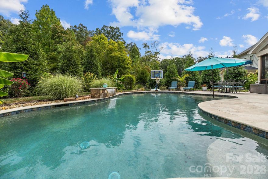 Live close to it all—Historic Waxhaw charm, Indian Land shopping/dining; Ballantyne, with award-winning Indian Land schools! Step into refined living in a beautifully designed home with a seamless open layout and main-level guest suite. Formal dining connects to a butler’s pantry and walk-in pantry for effortless entertaining. Upstairs, the airy loft complements a serene primary retreat featuring an oversized walk-in shower and dual closets, plus three additional bedrooms. Beautiful custom finishes throughout.
Outdoors becomes an everyday escape: a screened porch opens to a fenced yard with a resort-style saltwater, in-ground gunite pool and an expansive travertine terrace—perfect for gatherings or quiet weekends. Bent Creek elevates the lifestyle with a clubhouse, fitness center, outdoor pool, playground, dog park, and scenic walking trails and the advantage of South Carolina taxes.