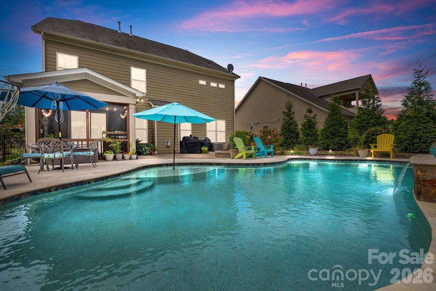 Live close to it all—Historic Waxhaw charm, Indian Land shopping/dining; Ballantyne, with award-winning Indian Land schools! Step into refined living in a beautifully designed home with a seamless open layout and main-level guest suite. Formal dining connects to a butler’s pantry and walk-in pantry for effortless entertaining. Upstairs, the airy loft complements a serene primary retreat featuring an oversized walk-in shower and dual closets, plus three additional bedrooms. Beautiful custom finishes throughout.
Outdoors becomes an everyday escape: a screened porch opens to a fenced yard with a resort-style saltwater, in-ground gunite pool and an expansive travertine terrace—perfect for gatherings or quiet weekends. Bent Creek elevates the lifestyle with a clubhouse, fitness center, outdoor pool, playground, dog park, and scenic walking trails and the advantage of South Carolina taxes.