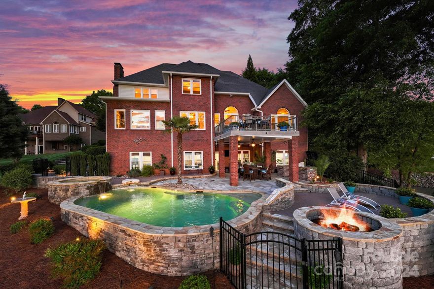 *2.375% ASSUMABLE loan* Windemere is a LIFESTYLE. This community boasts a social committee for event planning; additionally, is active w/ pickle ball, tennis and water aerobics making use of the amenities. The hidden community is nestled just a short drive through the scenic Lake Norman State Park from Troutman on the northern part of Lake Norman. This equal less boat traffic yet 10 min or less by boat from waterfront restaurants. Located about 10-15 miles from Mooresville, Troutman and Statesville. 45 miles from Charlotte Airport and DT Charlotte. This home features an outdoor space for entertaining, deep water access & the BEST GOLDEN HOUR for miles. The descent from the pool to the dock is gradual & has pristine landscaping with irrigation. The floorplan features a primary room on every level. The basement could be offered as a SECONDARY LIVING QUARTERS w/ its own kitchen, living room w/ fireplace and separate laundry.