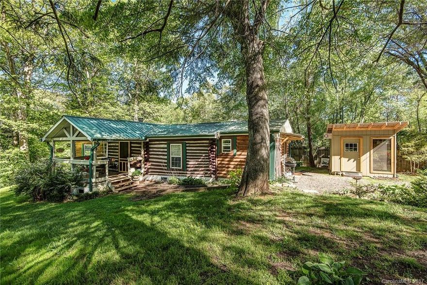 Price Reduction and Seller Motivated! Artists Must See! Historic 1900's 2 BR/1BA log cabin lovingly updated and nestled on 1+ acre private lot and only 10 minutes to town! Warm, inviting and beautifully appointed, this cabin features spacious eat in kitchen with abundance of cabinets and counter space, FP and privacy galore! Steps away to incredibly appointed 400 Sq Ft artist studio built in 2015 w/floor to ceiling windows, loft, and room for creativity and inspiration! Serenity abounds here!