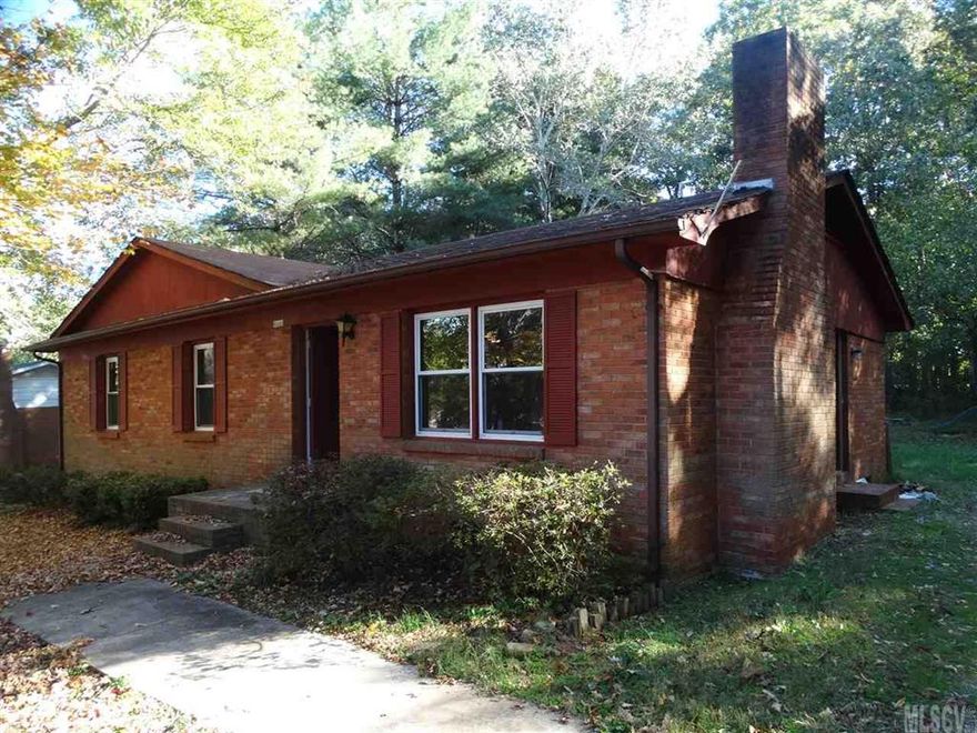 FRESH PAINT/BRAND NEW FLOORING/BRAND NEW HEATPUMP W/CENTRAL AIR!  NO CITY TAXES  or HOA FEES!  This home offers CONVENIENCE - to work, schools, shopping -- all are only a short distance away. DON'T miss the EXTRAS:  all on one level -- 3 bedrooms; 1.1 baths; living room has a wall-to-wall solid brick wood-burning fireplace with a wooden mantle; kitchen includes a range, refrigerator & dishwasher, washer/dryer area with 2 pantries; a bonus room could be an office/computer/craft room.  There is an extra attached storage room in back.  The large back yard has room for play, pets, and a fenced area for your pet or an herb/vegetable garden.  A one-year home warranty is included.