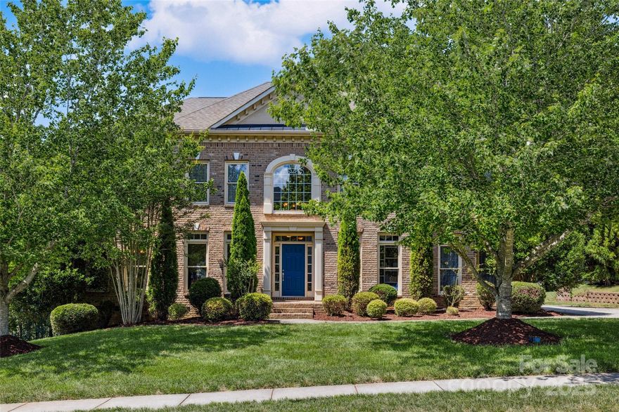 This well appointed John Wieland home sits on a wooded lot, on a well established street. The grand 2 story foyer offers a great entrance as you walk into a nice bright and open foyer. Stunning Whitney plan has formal areas, large two story windows for plenty of light, and a bedroom & bath on the main level. Gourmet kitchen with oversized Granite Island, tons of counter space and storage, Wall Oven, Gas Range and SS Appliances. Upstairs is the large Primary Bedroom with a spa-like Primary Bath featuring Dual Walk In Closets, Split Dual Vanity, Walk In Shower, and Whirlpool Tub. There are 3 other bedrooms and 2 baths on the second. The third floor offers a Bonus Room with great space with many options for use, and another full bath. There is still a ton of Walk In Attic space for storage on the third level. Outside, this home features an Outdoor Kitchen with a Pergola and Patio that is truly incredible. The 3 car garage has epoxy flooring. Close proximity to Clubhouse and amenities.