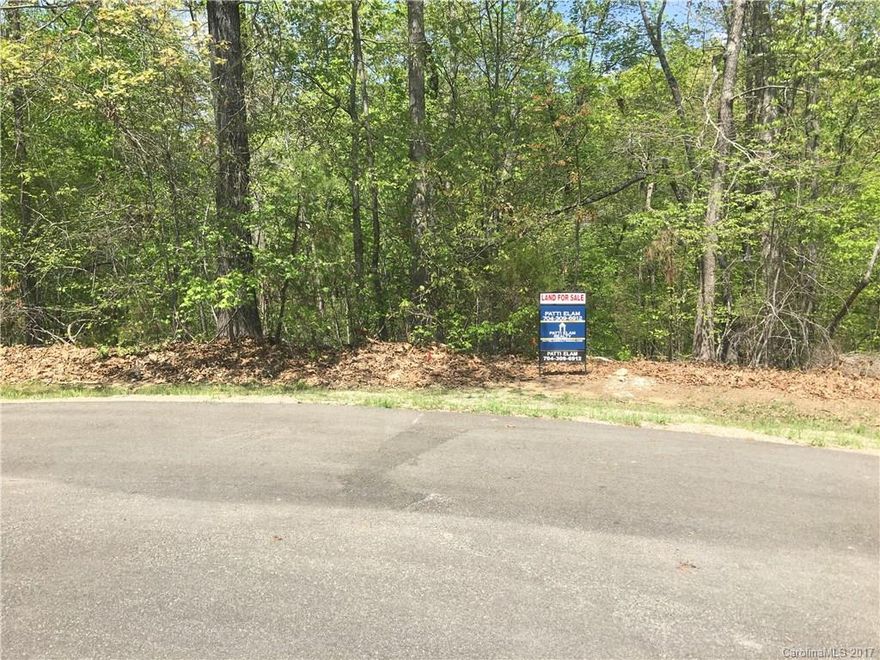 RARE FIND AND READY TO BUILD* BEAUTIFUL "Mountain (Feel) Scenic Secluded Lot" only minutes from Hwy 521 near Ballantyne....just waiting for you to build your home on this private wooded setting on cul-de-sac; creek on property which leads to a pond and pond access from certain parts of the lot.  Grade of lot suitable for walkout basement finished or unfinished (23 degree slope).  Seller has done all the due diligence so all you need is a builder!