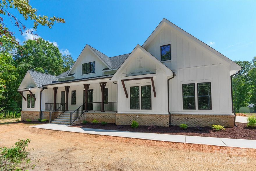 This stunning new construction nestled on 4 acres boasts a charming covered front porch. With 4 bedrooms and 2.5 baths, this spacious home offers versatile living options. The 4th bedroom can easily serve as an office, while a bonus room on the upper level, complete w/ a closet, provides the flexibility to be used as a 5th bedroom. The main living areas feature vinyl plank flooring, leading you to a kitchen equipped w/ an island, pantry, granite countertops, and SS appliances. The primary bdrm features tray ceilings and an ensuite bathroom with a dual vanity & a garden tub. The convenience continues w/ a laundry room that connects directly to the primary through a walk-in closet. The unfinished walk-out basement offers endless potential for additional living space. Enjoy outdoor living on the upper level covered porch or patio on the lower level. Enjoy the comfort of 2 HVAC units. And the best part? No HOA! This home is perfect for those seeking space & comfort in a beautiful setting.