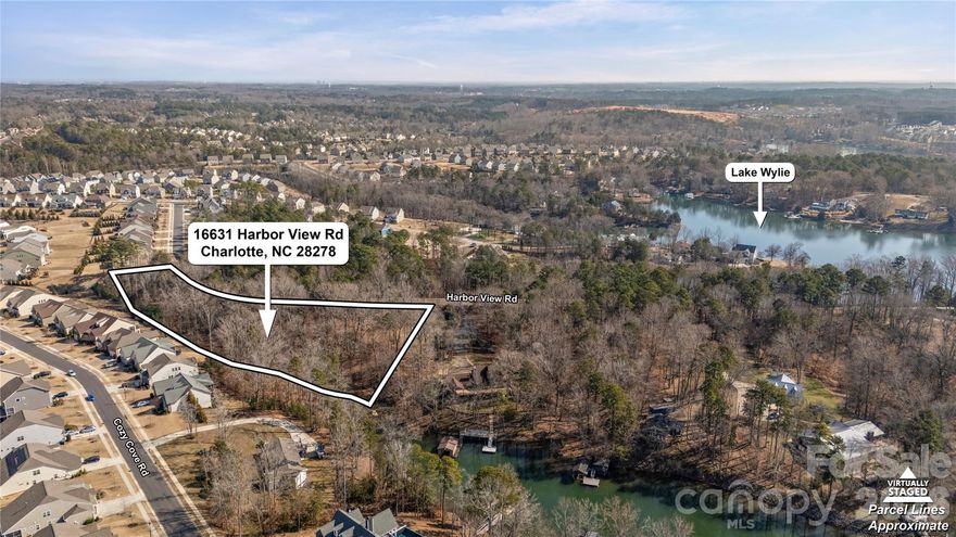 Rare opportunity to own 2.62 acres touching the shoreline of Lake Wylie just minutes from Charlotte. Properties offering this much land, water access, and proximity to the city are becoming increasingly difficult to find. This unique parcel provides lake access for kayaking, paddle boarding, and enjoying the natural setting. With 2.62 acres of usable land, the property offers exceptional flexibility. Buyers may choose to create a private estate, establish a multigenerational family compound, or explore the potential to subdivide into multiple homesites to maximize value (subject to approvals). The generous acreage provides privacy, space for custom home designs, and a rare development opportunity this close to Charlotte. For buyers seeking even greater potential, the waterfront home on the neighboring parcel is also available for purchase, creating the opportunity to control additional shoreline, expand acreage, or assemble a larger lakefront holding. Conveniently located near shopping, dining, and major commuting routes into Charlotte, this property offers a unique blend of lake access, acreage, development flexibility, and location—an increasingly rare combination in the Lake Wylie market.