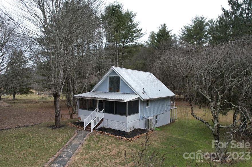 This home would be perfect for a first-time homebuyer, those who want to look at down-sizing, or to be used as a vacation retreat.  Home is conveniently located in a rolling valley between Linville Falls and Spruce Pine. You'll have easy access to the activities and attractions of the High Country. Close to Grandfather mountain, Linville caverns, and skiing. The unfinished basement will make a great opportunity to finish for even more living space. This home boast new mini splits and updated kitchen and bath. The sunsets from the screened front porch are great for entertaining or just relaxing. Sunrises are great on the back deck are great for drinking coffee and enjoying the sound of the creek. Make this home your mountain getaway today!