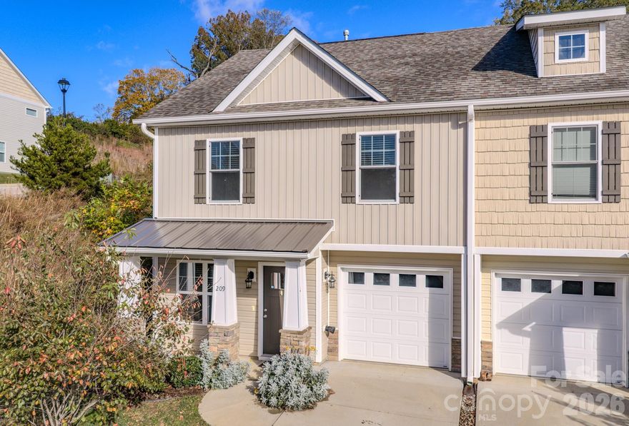 Move in with confidence—this thoughtfully updated end-unit townhome includes a transferable six-year home warranty, offering added peace of mind from day one.

Located in Candler just minutes from West Asheville and downtown Asheville, this home delivers a clean, move-in ready option in a market where timing and condition matter.

Inside, recent updates create a fresh, inviting feel. Brand-new carpet on the upper level adds comfort underfoot, while a newly installed tile backsplash brings a crisp, modern touch to the kitchen. Luxury vinyl plank flooring on the main level ties everything together with durability and easy maintenance.

The layout is simple and functional in all the right ways. The kitchen—with stainless steel appliances—opens directly to the dining and living areas, creating a natural flow for both everyday living and entertaining. A gas fireplace adds warmth and character to the living space, while a powder room and attached one-car garage provide practical convenience on the main level.

Upstairs, the primary suite offers a private retreat with its own bath. Two additional bedrooms and a full hall bath provide flexibility for guests, work-from-home needs, or hobbies. The upstairs laundry keeps everything within easy reach.

As an end unit, the home benefits from additional windows, bringing in natural light and creating a more open, airy feel throughout.

Beyond the walls, the lifestyle is designed to be low-maintenance. The HOA handles exterior upkeep, and with city water, sewer, and trash service already in place, ownership remains straightforward and predictable.

For buyers comparing options, this home offers a clear advantage—it’s complete, updated, and ready for immediate enjoyment.

If you’ve been looking for a well-maintained, move-in ready townhome in a highly convenient location, this one is ready to welcome you home.