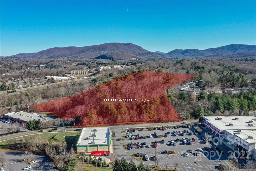 City of Asheville approval complete for a 153 unit apartment complex. Opportunity Zone. 10.9 acre +/- high profile parcel at the end of Tunnel Road in the River Hills Shopping Center next to several national retail brands including Dollar Tree, Target, Michaels, Movie Theaters, and Dick's. . Commercial Industrial zoning allows for many uses including retail, hospitality, multi-family, industrial, or mixed use. Site has great visibility from both directions of I-240 with 52,000 VPD. Recently assembled to frontage along River Hills Road to give access to upper part of the acreage via 400 feet +/- of road frontage. Completed due diligence items available include: Army Corp wetlands delineation, phase 1, Alta survey, project plans, traffic report, and Geotech.