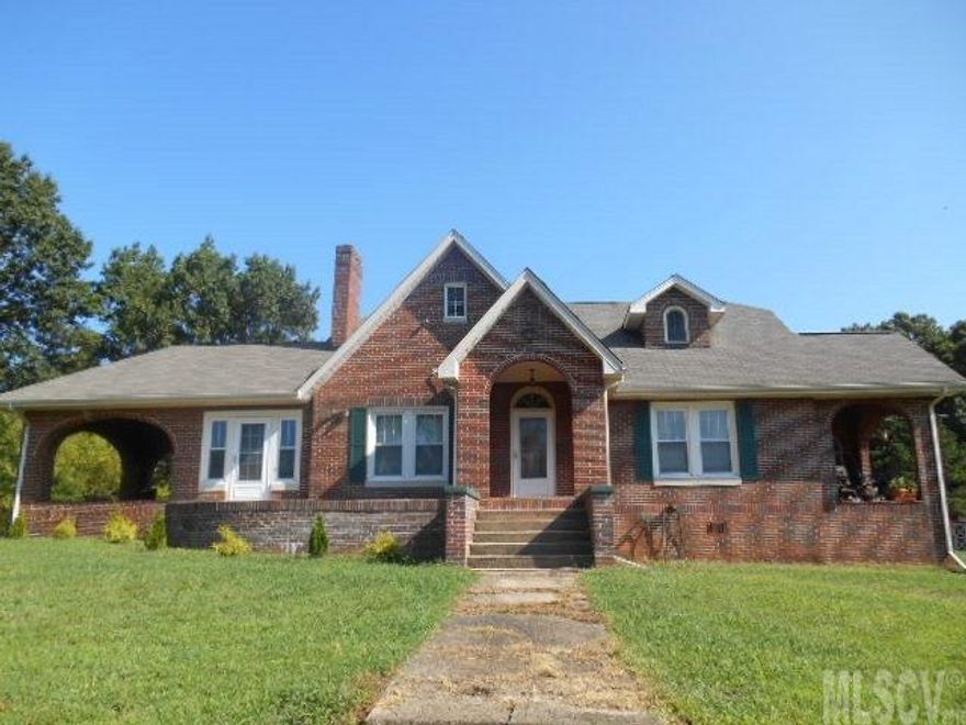 Gorgeous 5 Bedroom 3,100+ square feet, Brick Home with basement! Beautiful hardwood floors and open staircase. Best of both worlds (city/country)! Here is your chance to have the homestead you always wanted but still live close to everything! Level 2.77 acres, private setting. Green house, apple and other fruit trees, huge garden, plenty of grass for animals! 5 large bedrooms; 2 bedrooms on main level & 3 upstairs. Grill out on the covered, brick side porch or enjoy the winter from an enclosed & heated porch overlooking the mountain view. This home was built in 1934 with all the charm and character you expect of that era updated with modern conveniences! 2 Central Air units service the home so you can be comfortable. Seller to provide home a 1 year home warranty