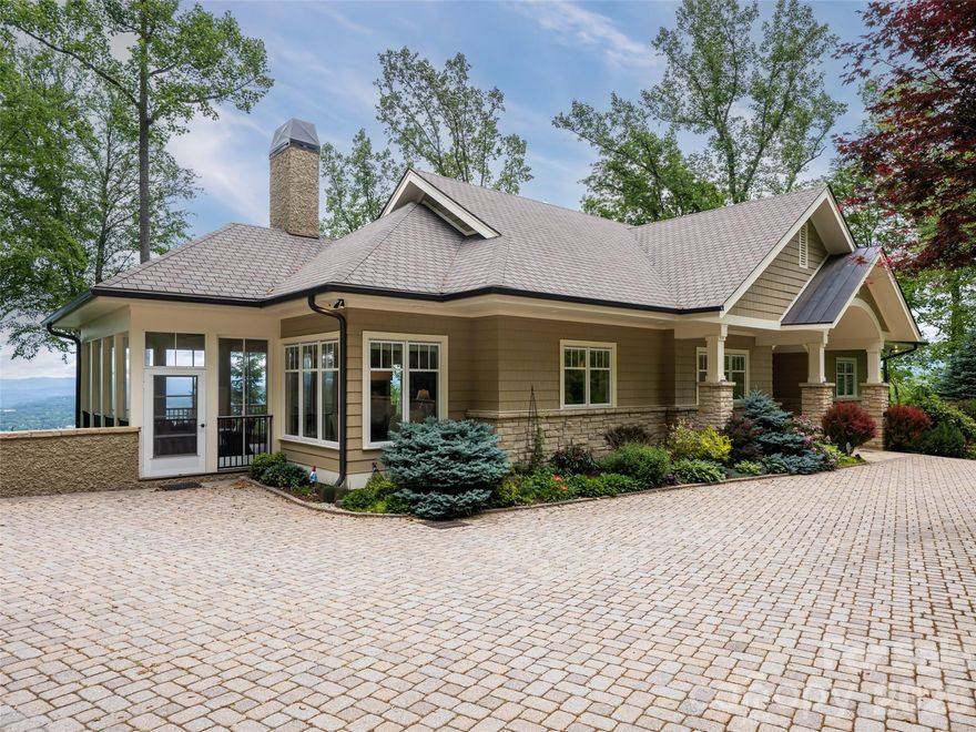 Luxury mountain home being offered fully furnished (with the exception of select pieces of furniture/artwork.)
Located in North Asheville off of Elk Mt. Scenic Hwy, this 7.5 acre estate offers 180 degree unobstructed views of The Blue Ridge Mts. Panoramic views both day and night! Built in 2009, this custom-built home is for the discriminating buyer seeking privacy yet convenient to restaurants, galleries and downtown Weaverville. Two exterior water features/ falls welcome you as you enter the driveway with cascading layers of water adding to the ambiance of this 4 bedroom/ 4 bath mountain retreat. The lower Terrace Level offers a private entrance/exit for family or guests. In addition, the Terrace level contains a Media room, Exercise Area, Billiards/Game room, Office and 2 bedrooms and 2 full baths. Whole house generator, private fenced walking trail and custom designed exterior steps allow easy access to the property. An elevator gives access to both floors if desired. No formal HOA or dues,  No Board of Directors, CCR's from original development.