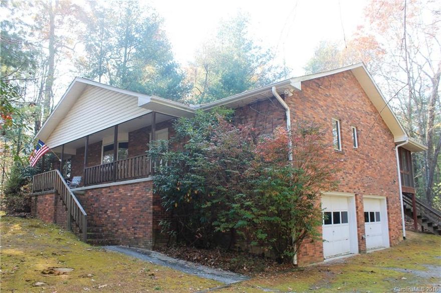 Great brick ranch convenient to downtown Hendersonville but yet private, Split bedroom plan with three bedrooms, two baths, .64 +/- acres, breakfast nook, covered front porch,  Full unfinished basement with double garage and plenty of room for a workshop. Don't miss this great home.