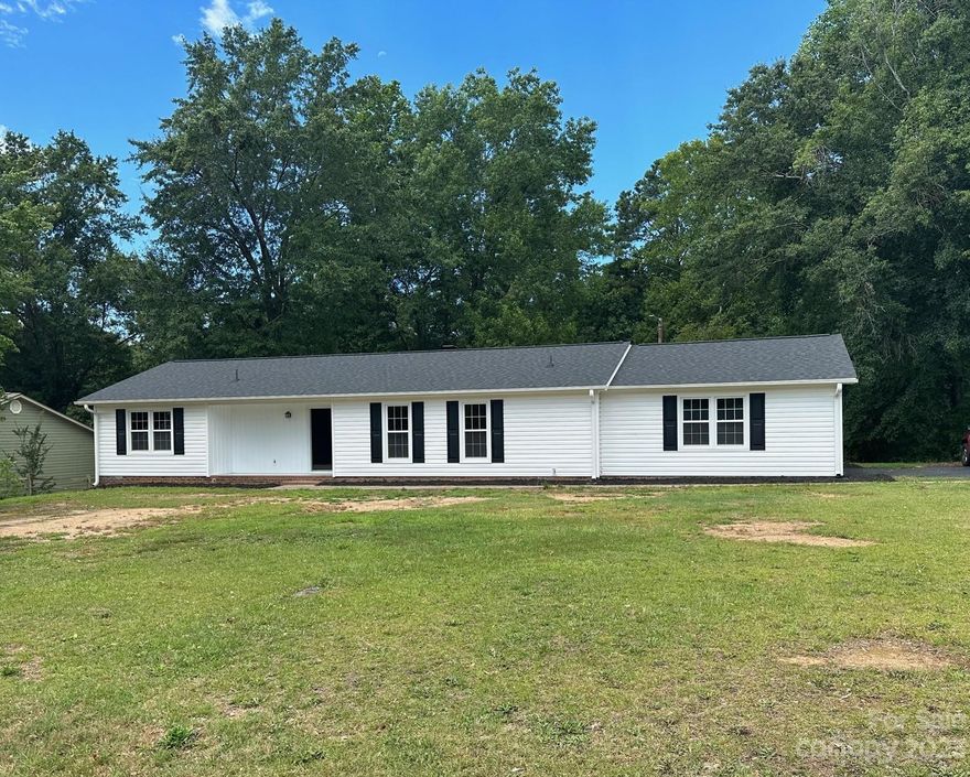 Newly renovated 3 bedroom, 2 bath home in District 6. The vinyl siding and vinyl tilt out windows are new and the roof was installed less than 5 years ago.  Luxury laminate flooring throughout the home.  The living area has a white washed brick wood burning fireplace as well as wooden beams on the ceiling.  The eat-in kitchen has a pantry and laminate countertops.  The master bedroom has a walk-in closet with built-in shelving as well as a an ensuite bath with tub/shower combo.  There is a nice deck out back off of the living room for entertaining or just relaxing. There is a 2 car garage that has a 4x20 storage area attached. This is a great home, schedule your showing today.