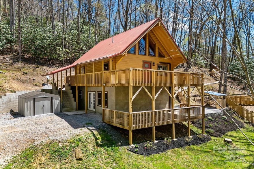 MOTIVATED SELLERS!! Escape to your cozy cabin mountain retreat at over 3,500 ft elevation with this charming log home on 2.41 unrestricted acres. Tucked into the woods with trails throughout, it features bold creek frontage, seasonal mountain views, and total privacy. Inside, enjoy an updated kitchen, wood floors, and stylishly updated bathrooms. The full basement offers a second kitchen, bedroom, and bath—perfect for guests, multigenerational living, or short-term rentals. A spacious loft with its own private bath served as the owners' suite, offering a cozy, elevated sanctuary. Live fully off-grid if you choose—equipped with a chicken coop, fruit bushes, and space to homestead—while reliable Starlink internet keeps you connected. Relax or entertain outdoors with a spacious porch, observation deck, tiki grill station, and firepit area. No HOA, short-term rentals allowed, and surrounded by nature—this property is a rare blend of comfort, freedom, and mountain charm.