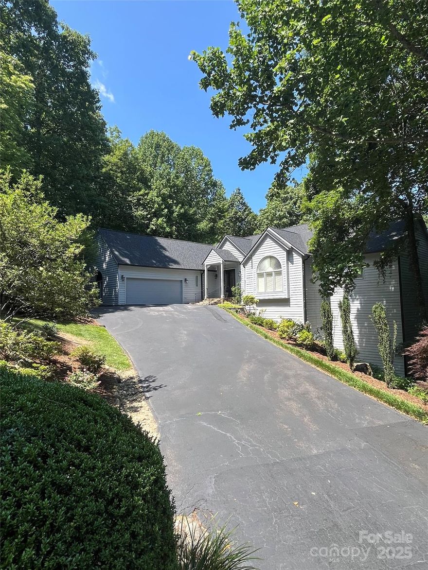 Beautiful updated estate home in Kenmure. Main level has open floor plan with mountain views. Great room has vaulted ceilings, large windows, fireplace with gas logs and formal dining. Gourmet kitchen is equipped with stainless steel appliances, walk-in pantry and keeping room. Primary bedroom has luxurious spa like bathroom and large walk-in closet. Office and laundry also located on main level. Lower level has family room with pool table, fireplace with gas logs, two guest bedrooms and three full bathrooms. This home is being sold furnished. Natural gas generator for peace of mind. Kenmure Charter membership included!